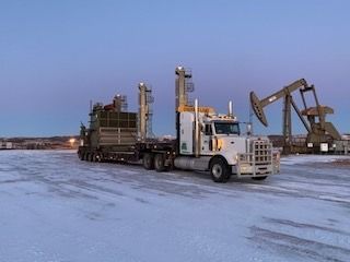 BDS truck delivering load to oil sands